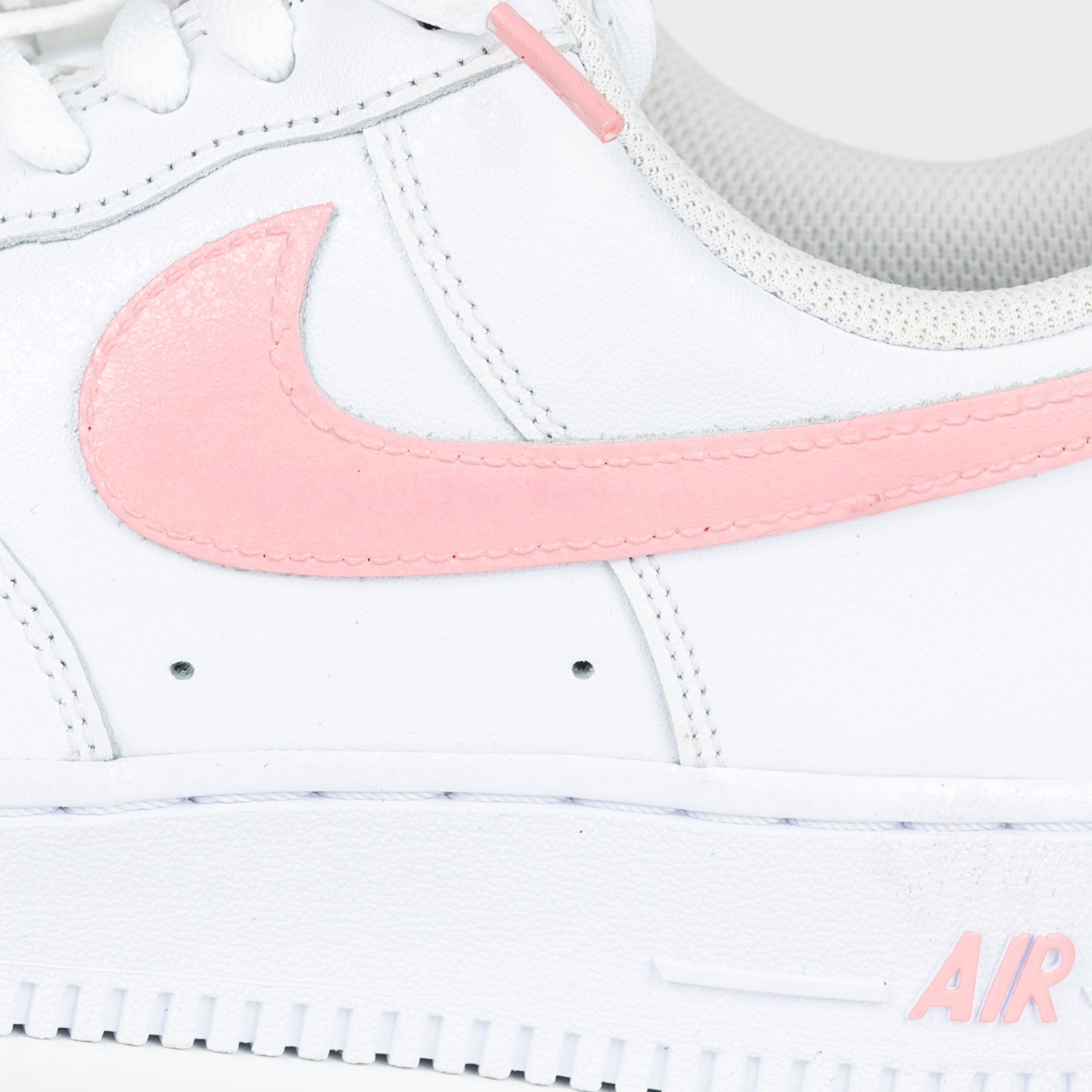 white and light pink air force 1